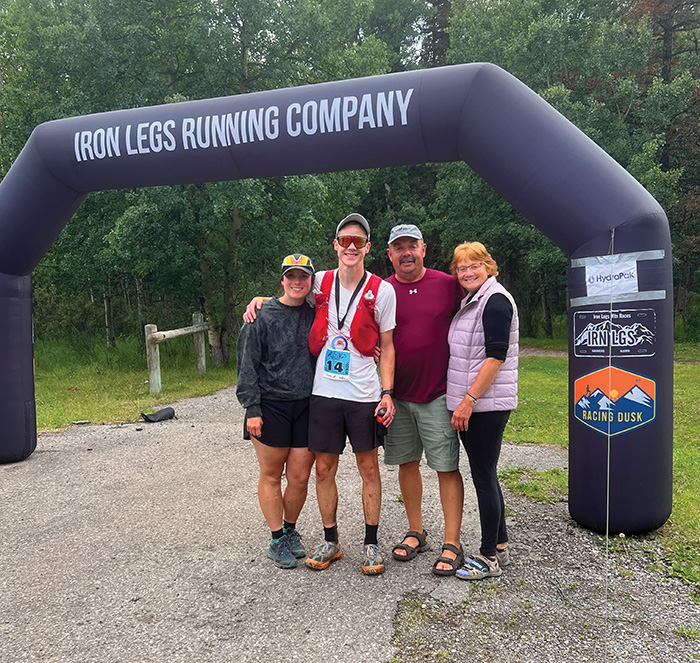 Austin with his family at the Iron Legs 100 km race he won, August 2024.<br />
e